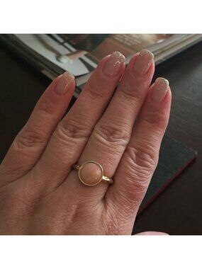 Ring with light pink stone